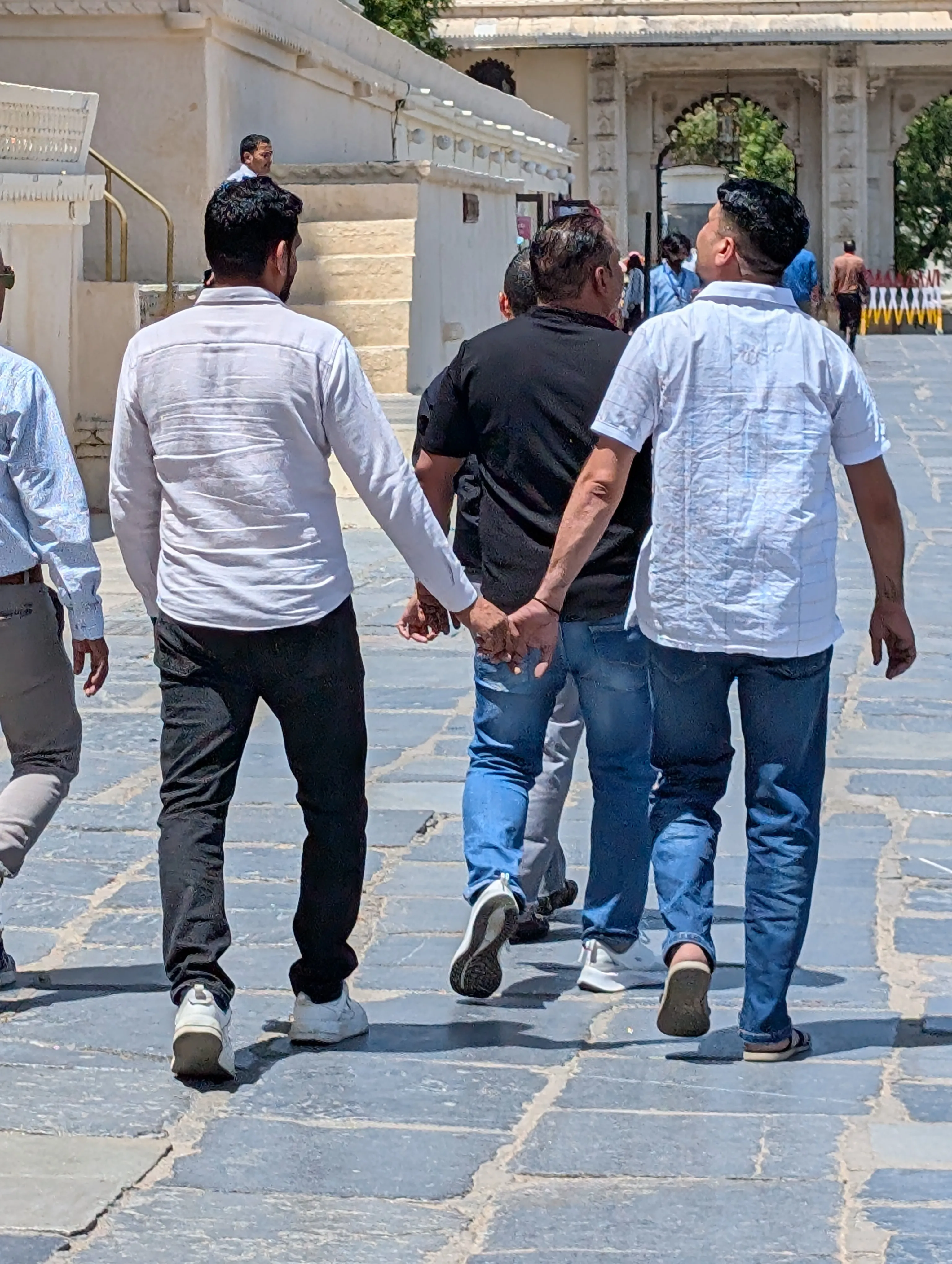 Two friends holding hands