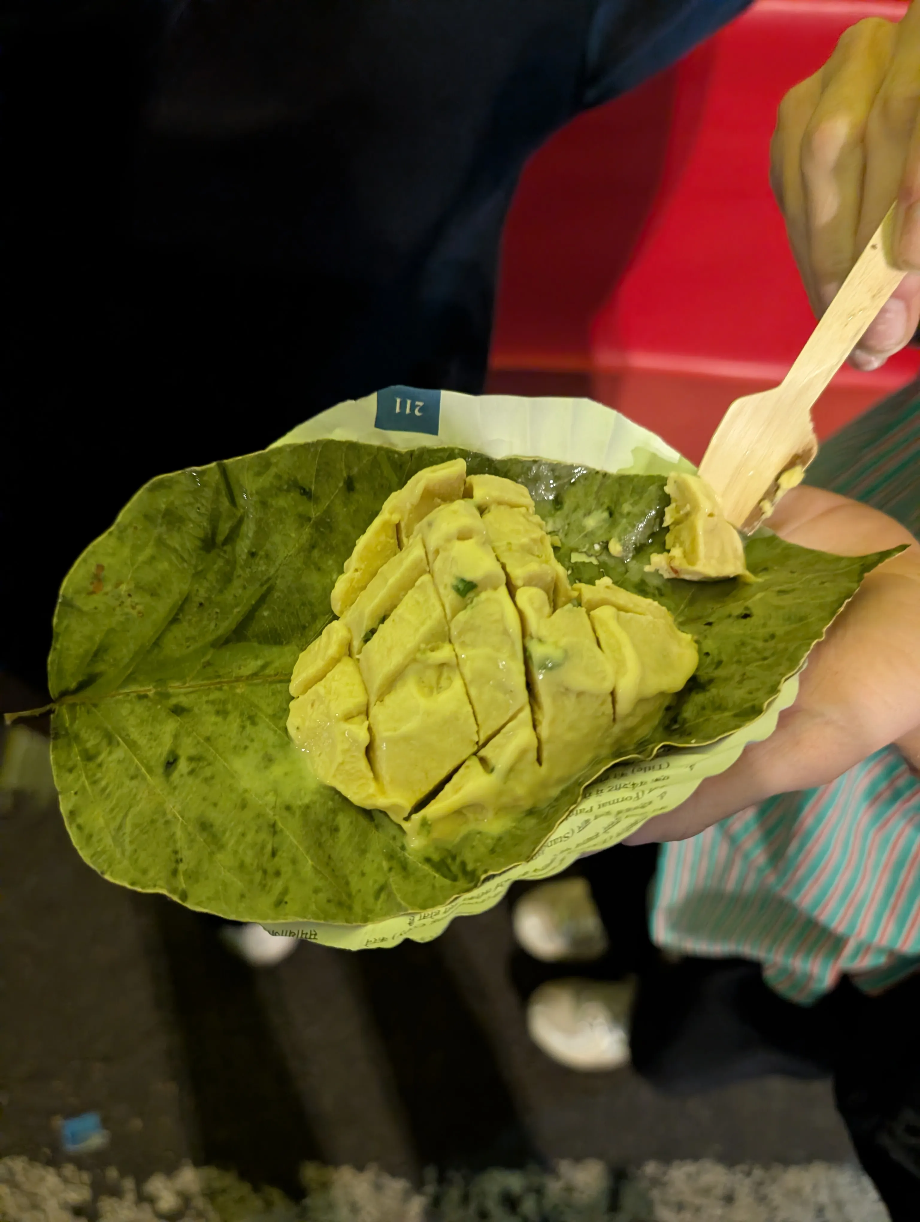 Local ice cream served on a leaf from the Jaipur street food tour.