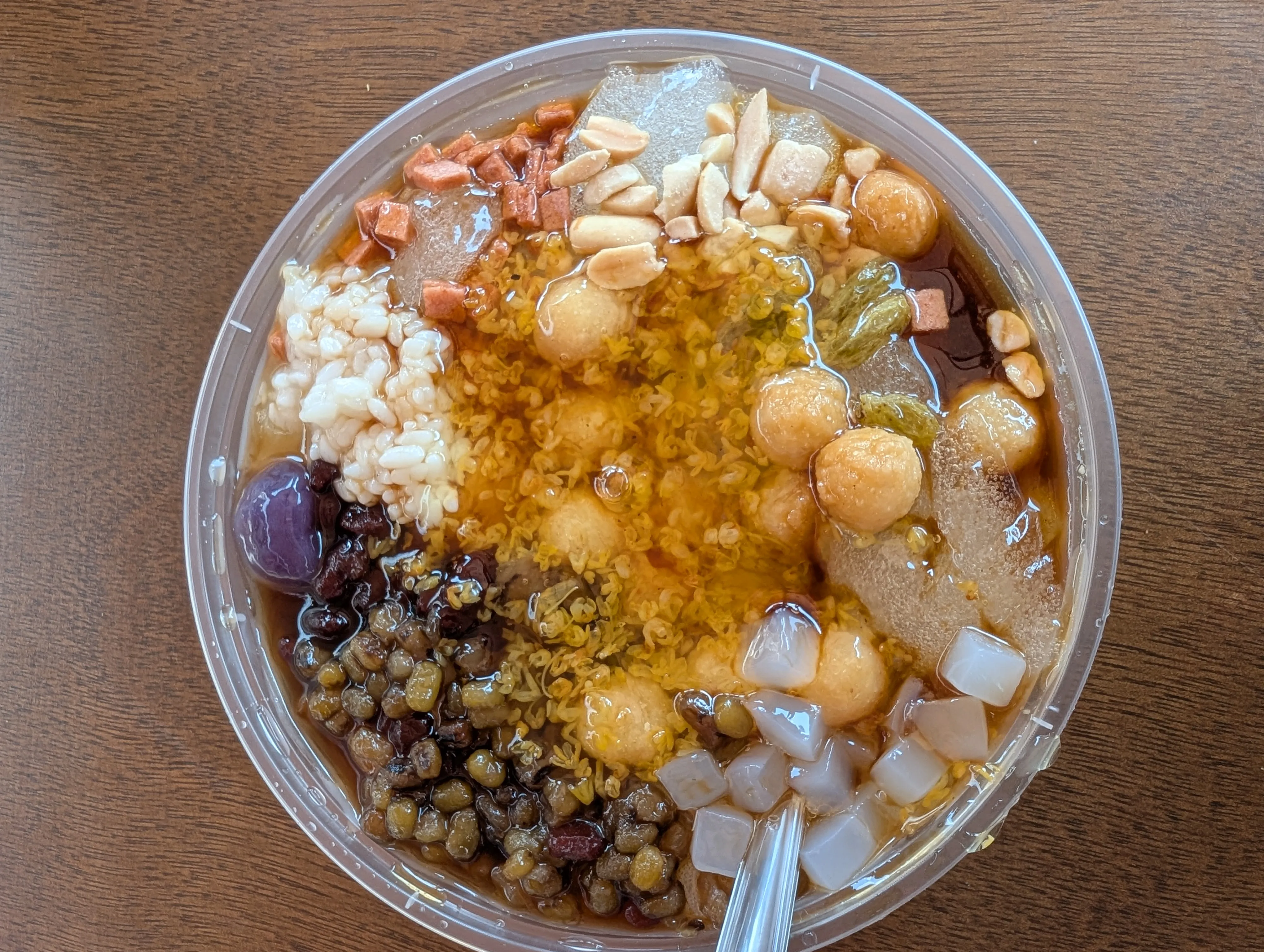 Ice jelly (bingfen), a refreshing street dessert from Sichuan: clear jelly cubes in a sweet, tangy syrup with toppings.