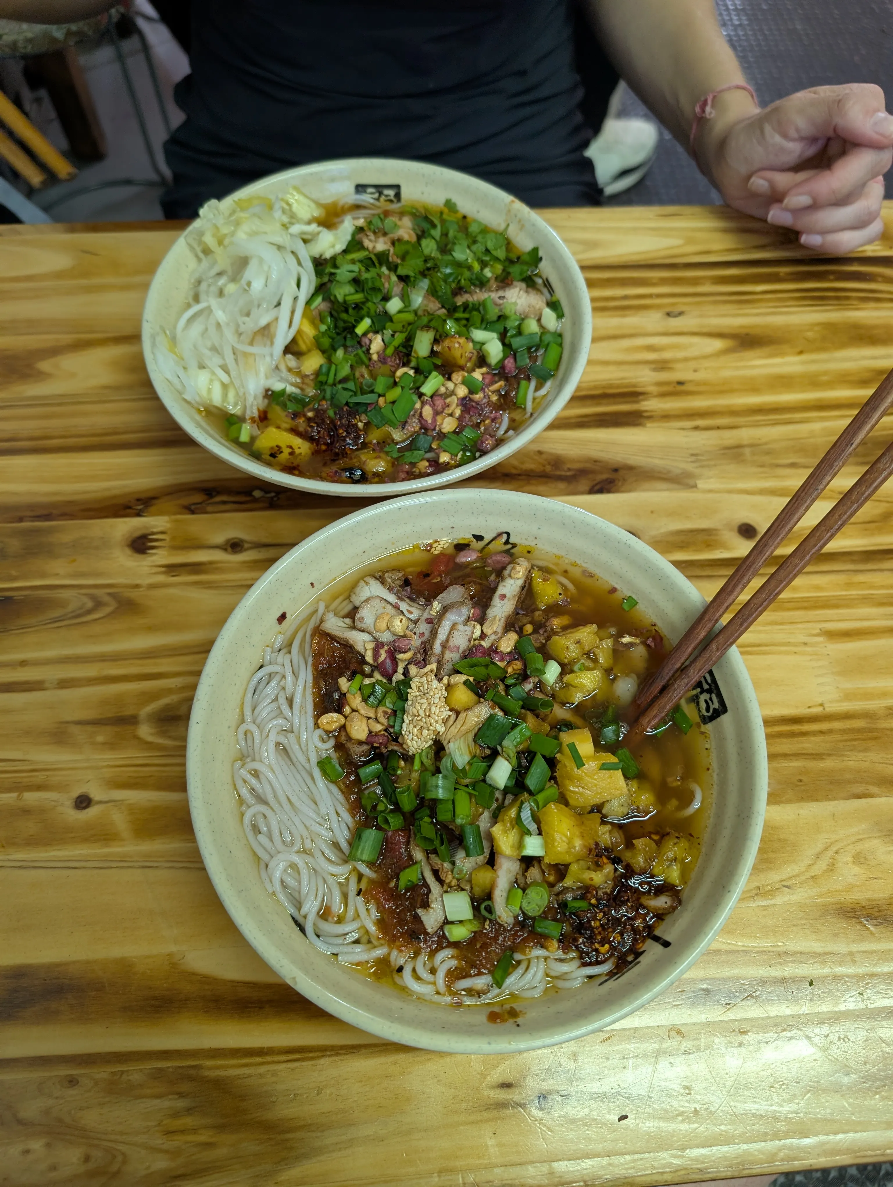 A Dai noodle dish in Kunming with smoky pork and pineapple.