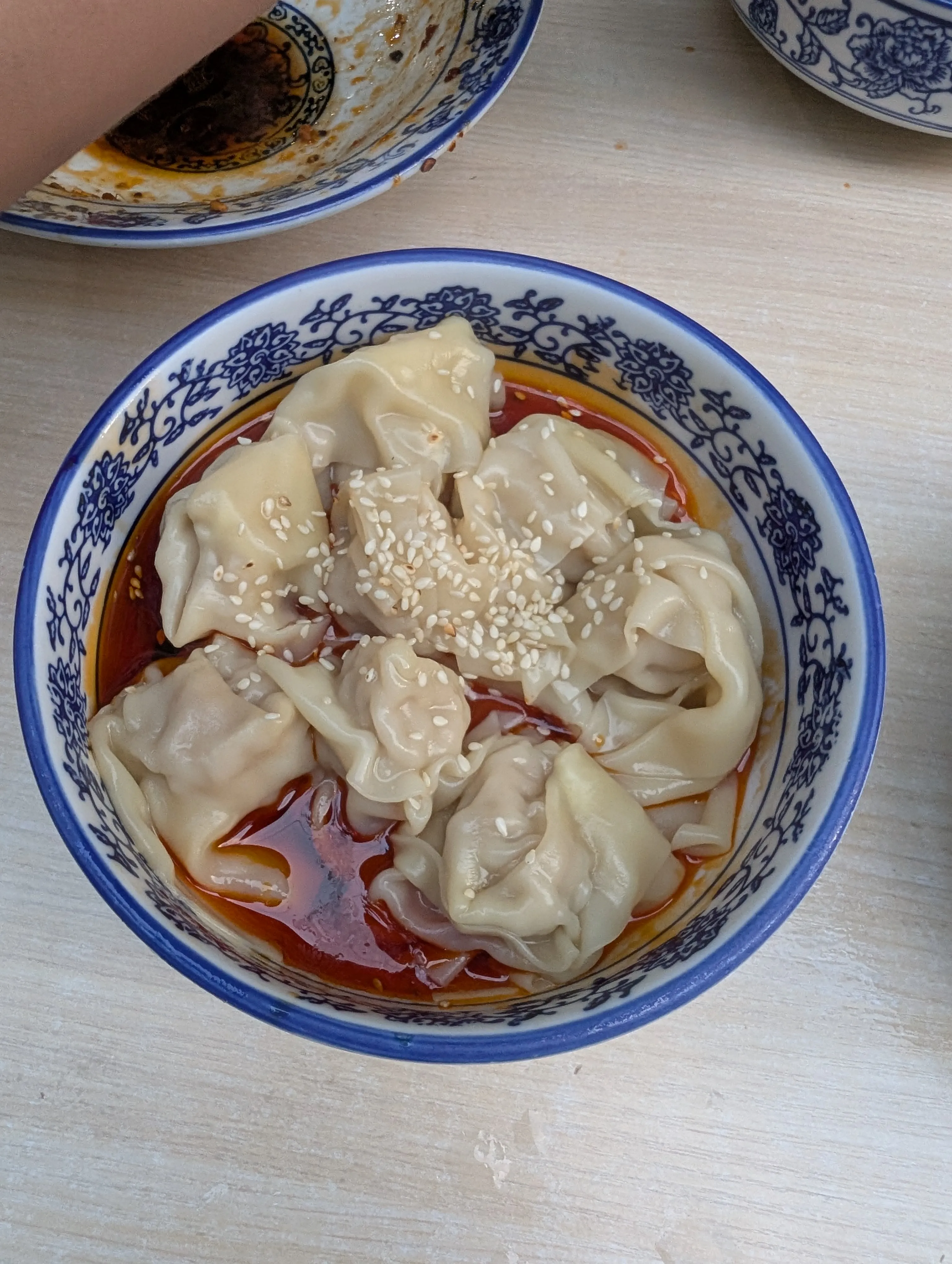 Spicy wontons bathed in chili oil, soy sauce, and sesame.